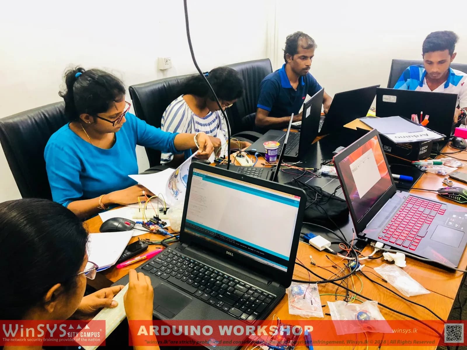 Students working on an Arduino robotics workshop