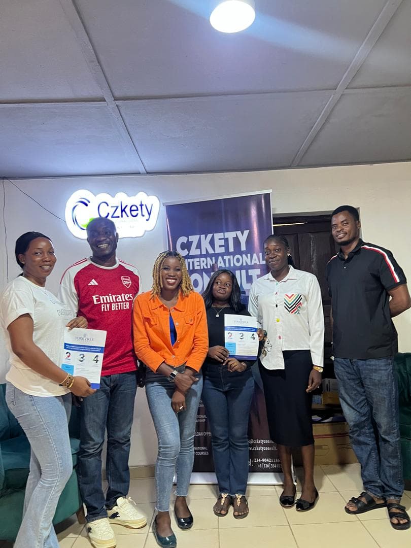 Czkety team meeting with a partner university representative in their Lagos office